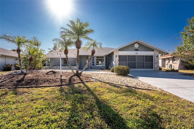 ranch-style house with a garage and a front yard