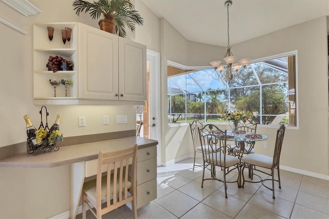 dining area featuring an inviting chandelier and light tile patterned floors