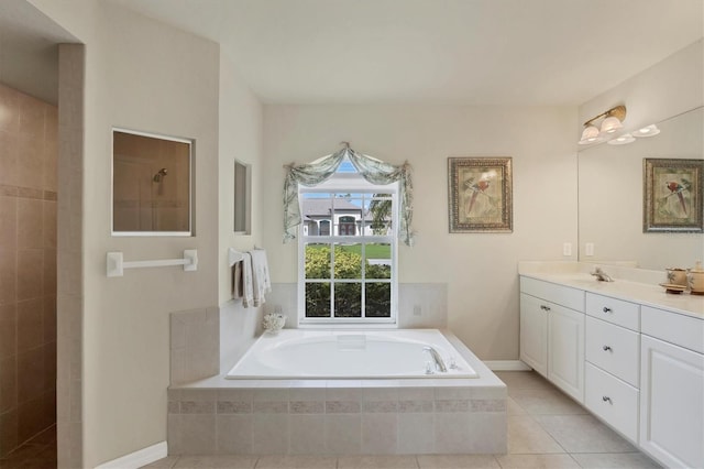 bathroom featuring tile patterned flooring, vanity, and separate shower and tub