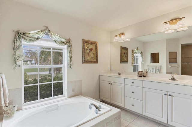 bathroom featuring vanity, tile patterned flooring, and a relaxing tiled tub