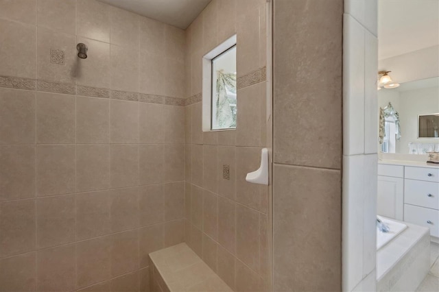 bathroom featuring vanity and a tile shower