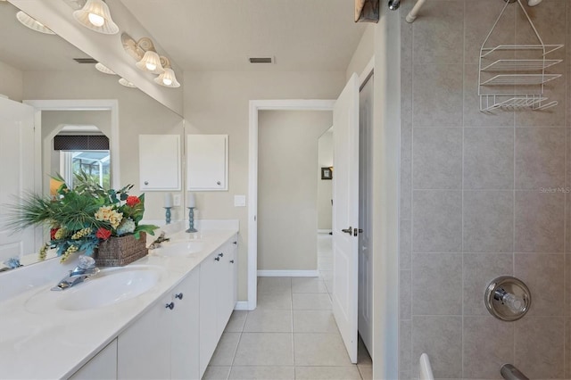 bathroom with tile patterned flooring and vanity