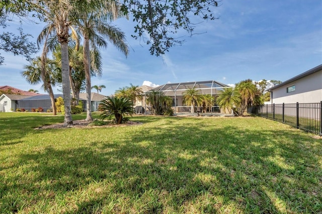 view of yard featuring glass enclosure