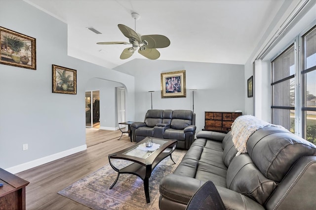 living room with vaulted ceiling, ceiling fan, and hardwood / wood-style floors