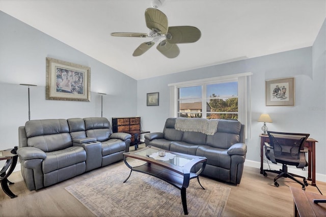 living room with ceiling fan, lofted ceiling, and light wood-type flooring