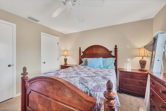 bedroom with light carpet and ceiling fan