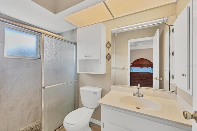 bathroom featuring vanity, toilet, and walk in shower