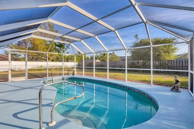 view of pool featuring a patio and glass enclosure