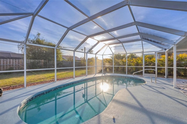 view of pool with a lanai and a patio area