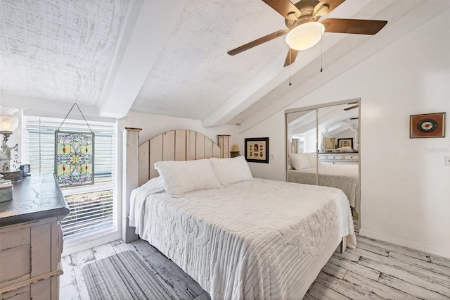 bedroom with light hardwood / wood-style flooring, lofted ceiling with beams, and ceiling fan