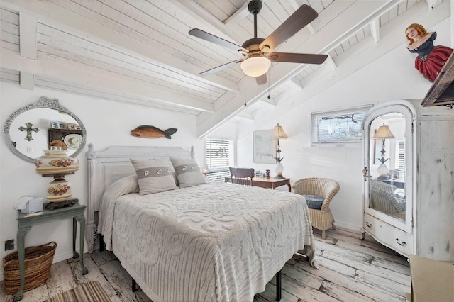 bedroom with vaulted ceiling with beams, wood ceiling, light hardwood / wood-style floors, and ceiling fan