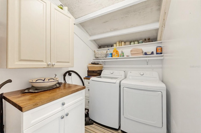 laundry room with cabinets and independent washer and dryer