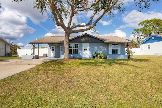 ranch-style house featuring cooling unit, a front lawn, and a carport