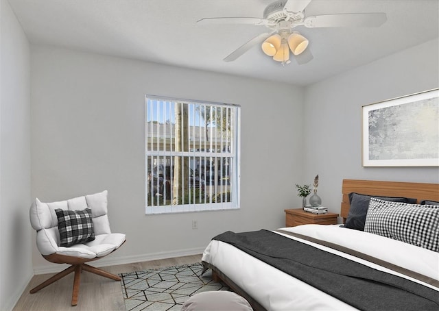 bedroom featuring ceiling fan and light hardwood / wood-style flooring