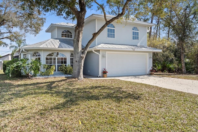 view of front of property with a garage and a front yard