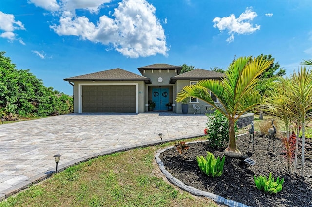 view of front of property with a garage