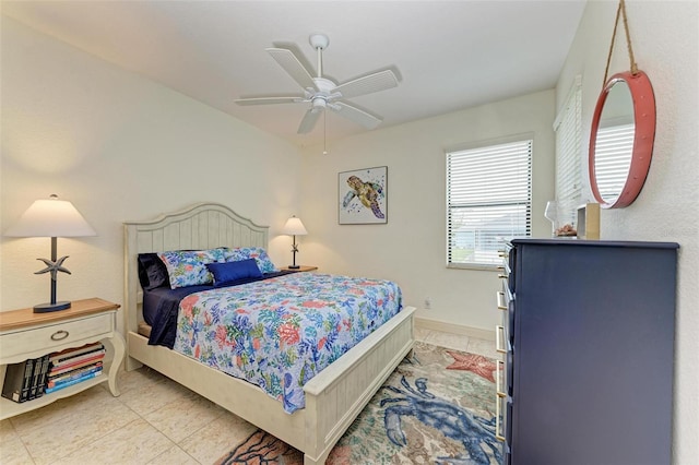 tiled bedroom with ceiling fan