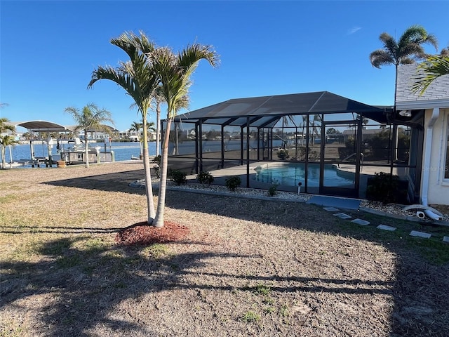 dock area with a lanai, a patio area, and an outdoor pool