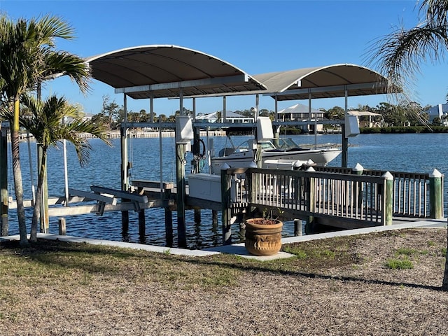 view of dock featuring a water view and boat lift