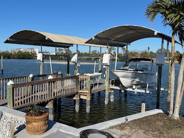 view of dock featuring a water view and boat lift