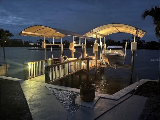 view of dock with a water view and boat lift