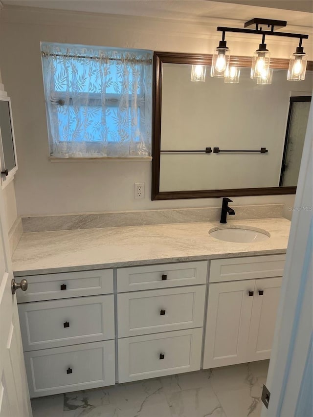 bathroom featuring marble finish floor and vanity