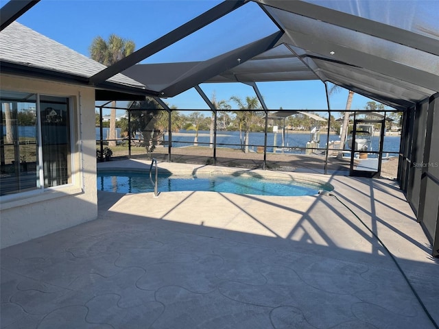 pool with a patio area and glass enclosure