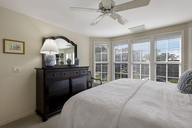 bedroom with light carpet and ceiling fan