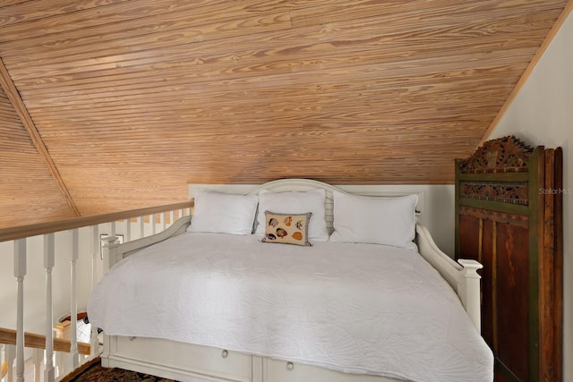 bedroom with wood ceiling and lofted ceiling