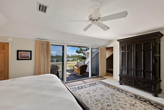 bedroom featuring light carpet, access to exterior, vaulted ceiling, and ceiling fan