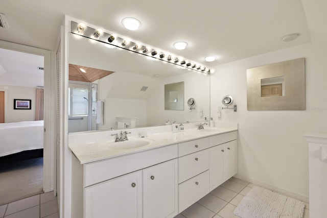 bathroom with vanity, tile patterned floors, and toilet