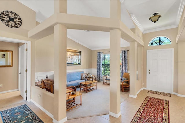 entryway with light tile patterned floors, crown molding, and high vaulted ceiling