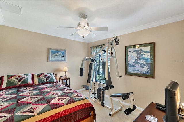 carpeted bedroom featuring crown molding and ceiling fan