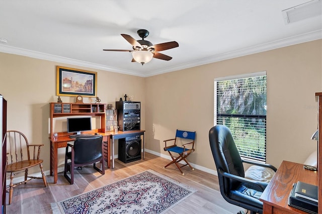 office space with ceiling fan, ornamental molding, and light hardwood / wood-style floors