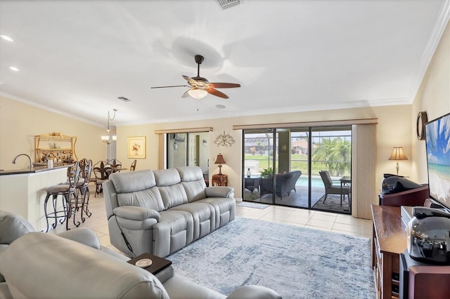 39 Tournament Rd, Rotonda West, FL 33947 - living area featuring light tile patterned floors, a ceiling fan, and ornamental molding