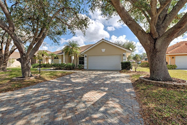 ranch-style home featuring a garage