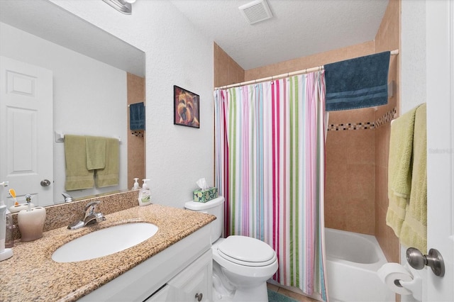 full bathroom with vanity, a textured ceiling, shower / bath combination with curtain, and toilet