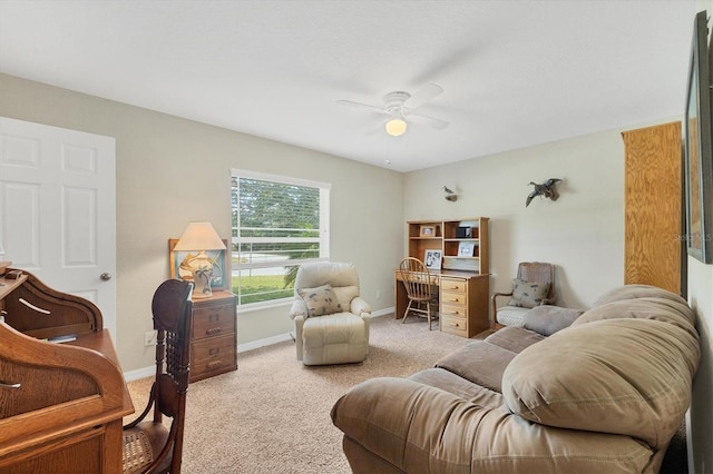 interior space with carpet floors and ceiling fan