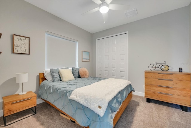 bedroom with light carpet, a closet, and ceiling fan