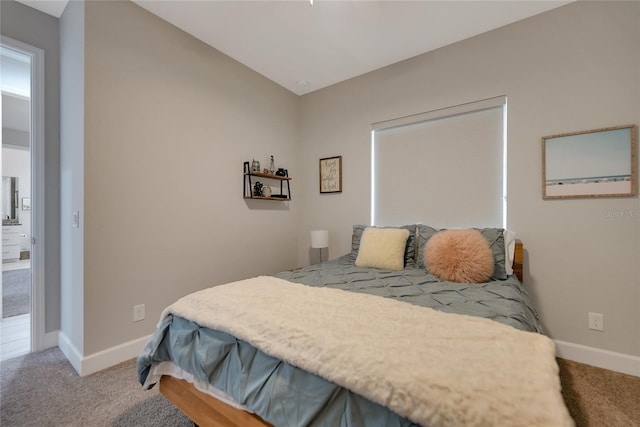 bedroom featuring light colored carpet