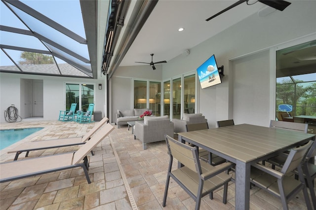 view of patio featuring ceiling fan, an outdoor hangout area, and a lanai