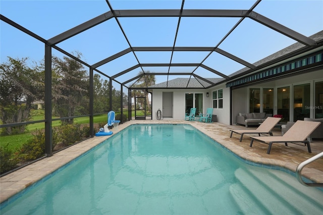 view of swimming pool featuring an outdoor living space, a patio, and glass enclosure