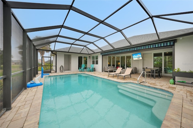 view of pool with a lanai and a patio area