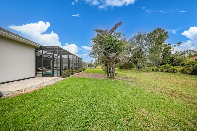 view of yard featuring a lanai and a patio area