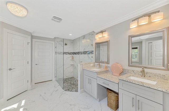 bathroom featuring a tile shower, vanity, and ornamental molding