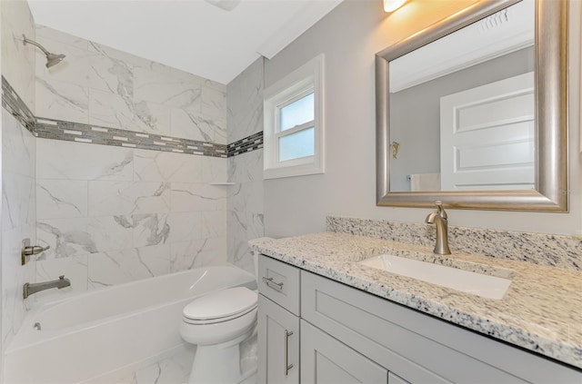 full bathroom featuring vanity, toilet, and tiled shower / bath