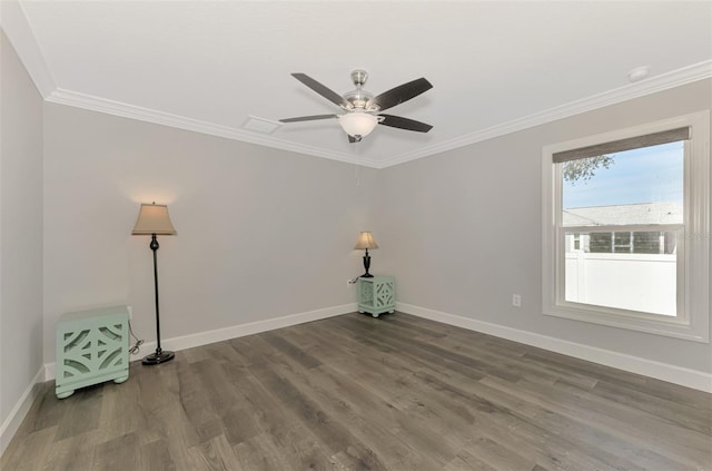 spare room featuring hardwood / wood-style flooring, ornamental molding, and ceiling fan