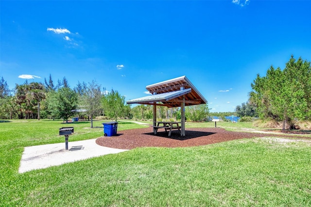 view of property's community with a lawn