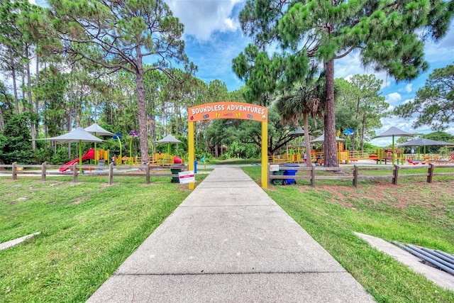 view of community with a playground and a yard