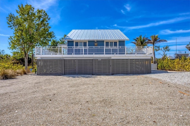 view of front of property with a wooden deck